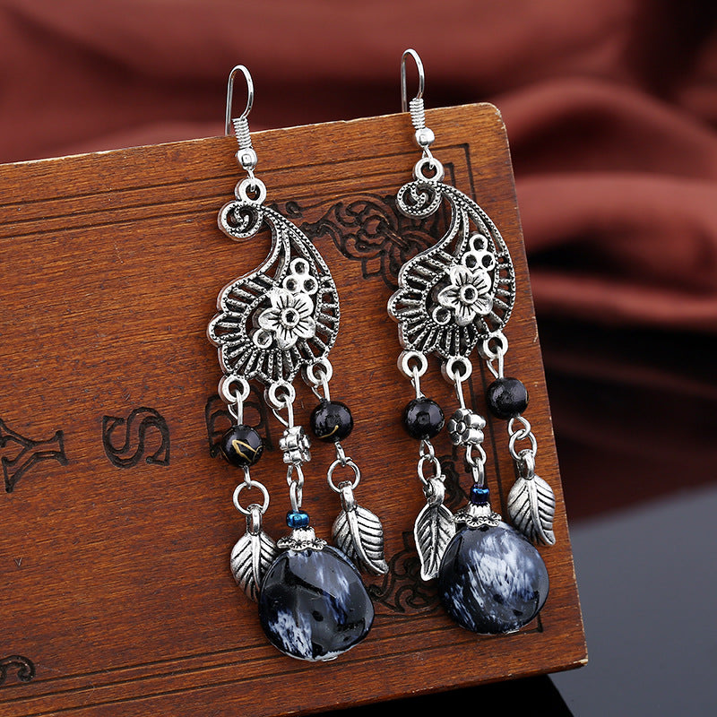 Wholesale retro hollow carved leaves tassel earrings